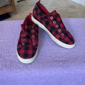 Womens slip on Red and Black checkered sneakers.
